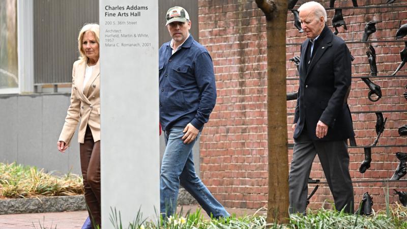 US President Joe Biden and US First Lady Jill Biden, joined by Hunter Biden, depart after attending an art show 