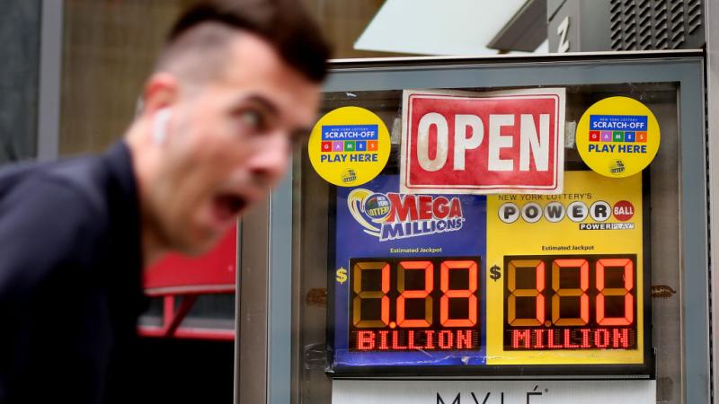 A sign advertising a $1 billion+ Mega Millions jackpot